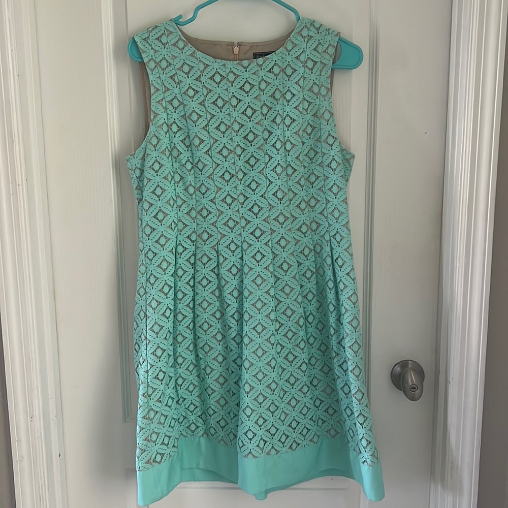 Sea foam color, size P12, zip up back.